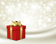Red gift with gold bow on silk vector background Red gift with gold bow on silk vector background