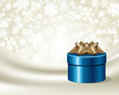 Blue gift with gold bow on silk vector background Blue gift with gold bow on silk vector background