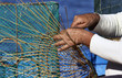 Italy, Sicily, a fisherman making a lobster pot