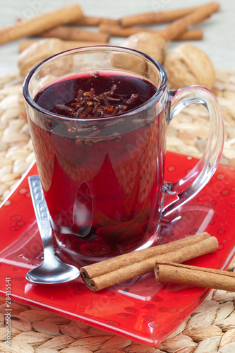 Photo: Glass of mulled wine with spoon and cinnamon Glass of mulled wine with spoon and cinnamon