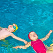 Foto: Children in a swimming pool Children in a swimming pool