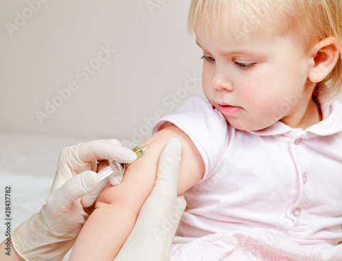 Photo: Little baby girl gets an injection Little baby girl gets an injection