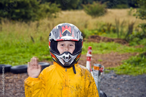 Photo: happy boy with helmet at the kart trail happy boy with helmet at the kart trail