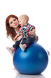 Happy family with  fitness ball.