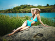 Slim girl sunbathing on the nature