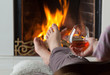 Resting at the burning fireplace fire with a glass of cognac