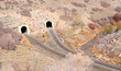 Dual Railroad Tunnels in Desert Canyon