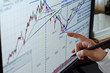 Foto: Market Analyze - Closeup hand on LCD Market Analyze - Closeup hand on LCD