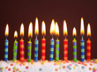 Birthday candles on brown background