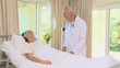 Woman in coma lying on the bed with an oxygen mask
