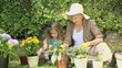 Grandmother and granddaughter gardening together