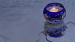 Floating candles in a candlestick with Christmas pattern