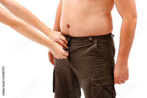 Photo: Hands opening or closing man's placket Hands opening or closing man's placket