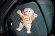 stuffed angel suctioned to the window of a car stuffed angel suctioned to the window of a car
