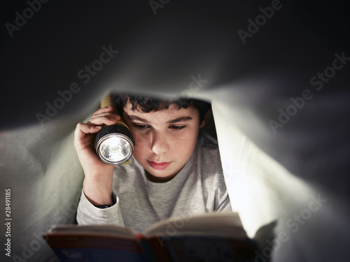 Photo: boy reading book boy reading book