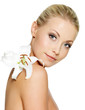 Beautiful woman with  clean skin and white flower