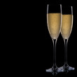 A glass of champagne, isolated on a black background. A glass of champagne, isolated on a black background.