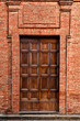 Antique tuscan door in Pienza, Italy.