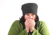 Photo: Woman blowing hot air in cold hands Woman blowing hot air in cold hands