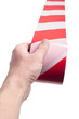 Red white cordon tape in hand Red white cordon tape in hand