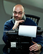Old fashioned bald writer in glasses writing book Old fashioned bald writer in glasses writing book