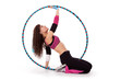Fitness teacher posing in hula hoop