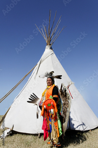Photo: American Indian in Front of Tee Pee American Indian in Front of Tee Pee