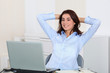Businesswoman with stretched arms in office