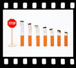Seven cigarets and sign "Stop" in a film frame