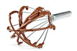 Metal whisk with chocolate isolated on white Metal whisk with chocolate isolated on white