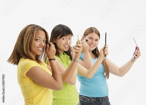 Photo: Three Teens Applying Make Up Three Teens Applying Make Up