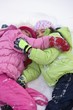 Photo: Friends Lying In The Snow Friends Lying In The Snow