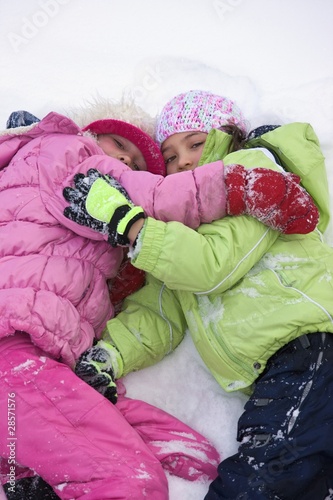 Photo: Friends Lying In The Snow Friends Lying In The Snow