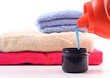Laundry Detergent Pouring Into Measuring Cap
