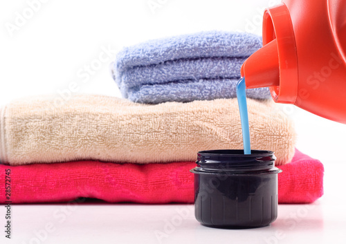 Photo: Laundry Detergent Pouring Into Measuring Cap Laundry Detergent Pouring Into Measuring Cap