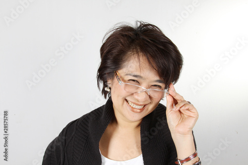 Photo: Asian Woman with natural smily face wearing glasses. Asian Woman with natural smily face wearing glasses.