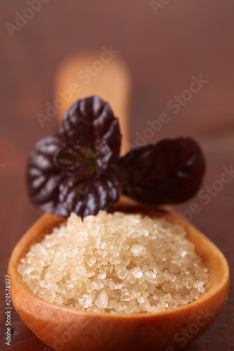 Photo: Cane sugar in a wooden spoon Cane sugar in a wooden spoon