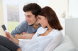 Young couple looking at sonogram of their future baby Young couple looking at sonogram of their future baby