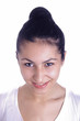 A high key portrait of a brunette young girl
