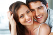 An attractive young couple smiling together