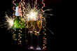 Bottle of champagne, two glasses, ribbons and sparklers. Bottle of champagne, two glasses, ribbons and sparklers.
