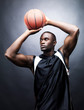 Young basketball player in action against grunge background