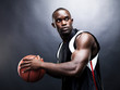 Muscular young afroamerican man playing basketball Muscular young afroamerican man playing basketball