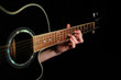 Man's hand striking a chord