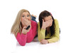 two young pretty woman watching television and switching channel