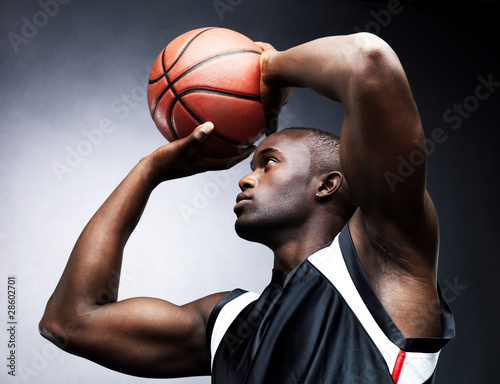 Photo: Basketball free throw - Young man preparing for a penalty shot Basketball free throw - Young man preparing for a penalty shot