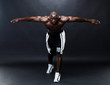 Perfect Physique - Muscular young man stretching his arms