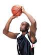 Confident basketball player taking free throw against white