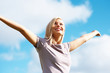 Happy beautiful girl with the blue sky