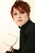 Woman in Suit with Glasses